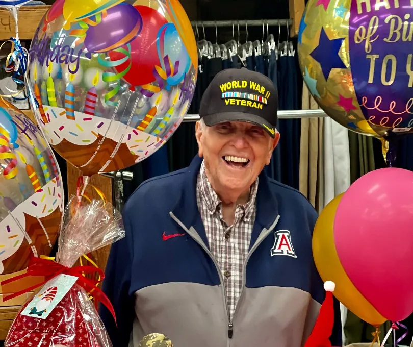 Don Sloane, WWII veteran and owner of Millers Surplus, wearing a World War II veteran cap