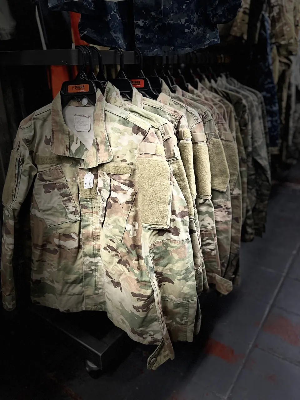 Military camouflage jackets on the rack at Millers Surplus