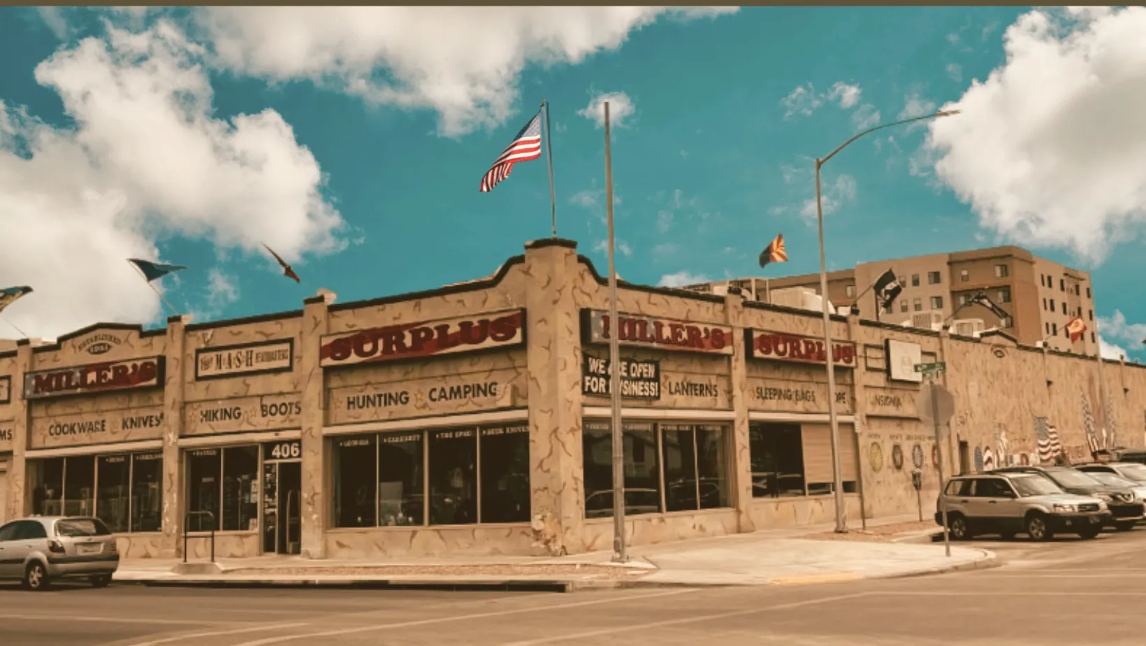 The Millers Surplus building on 6th Ave in Tucson with the American flag flying
